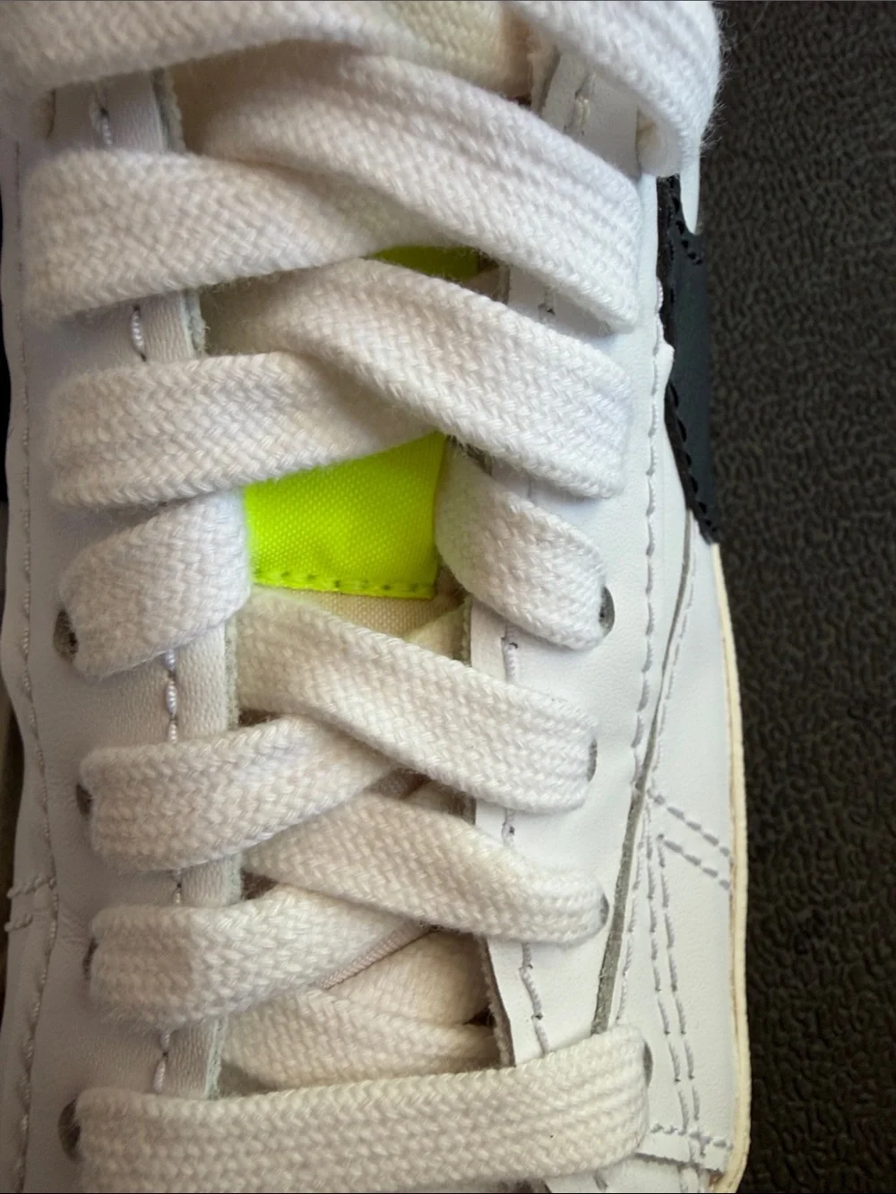 Nike White Sneakers with Neon Yellow Tongue Tab and Orange Swoosh